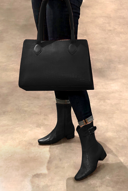 Satin black women's ankle boots with buckles on the sides. Round toe. Low block heels. Worn view - Florence KOOIJMAN